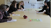 Alex Oma-Pius speak with pupils from Royal Docks Community School